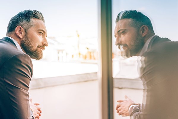 bearded-business-man-reflecting